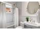 A well-lit bathroom with white subway tile, classic fixtures, and patterned tile flooring at 758 Argonne Ne Ave, Atlanta, GA 30308