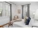 Cozy bedroom featuring natural light, white walls, and hardwood floors at 758 Argonne Ne Ave, Atlanta, GA 30308