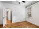 A sunlit bedroom with hardwood floors, fresh paint, and an open door to an adjacent room at 758 Argonne Ne Ave, Atlanta, GA 30308