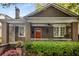 Charming brick home with a cozy front porch, featuring decorative columns and a wooden front door at 758 Argonne Ne Ave, Atlanta, GA 30308