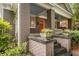 Inviting front porch with brick columns, stone steps, and decorative planters at 758 Argonne Ne Ave, Atlanta, GA 30308