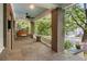 Spacious front porch with a porch swing, stone flooring, and a ceiling fan at 758 Argonne Ne Ave, Atlanta, GA 30308