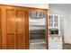 This kitchen features a stainless steel refrigerator and built-in microwave on a wooden floor at 758 Argonne Ne Ave, Atlanta, GA 30308
