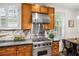 This kitchen features stainless steel appliances, wooden cabinets, and stone countertops at 758 Argonne Ne Ave, Atlanta, GA 30308