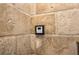 Close up of shower controls in a bathroom with a walk-in stone shower at 758 Argonne Ne Ave, Atlanta, GA 30308