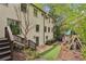 Exterior view of the backyard with a stone pathway, a play area and lush landscaping at 4431 Skyland Ne Dr, Atlanta, GA 30342