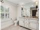Bathroom with double vanity, granite countertops, and neutral color palette at 4431 Skyland Ne Dr, Atlanta, GA 30342