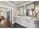 Modern bathroom boasts dual sinks, marble counters, large mirrors, and stylish sconces at 4431 Skyland Ne Dr, Atlanta, GA 30342
