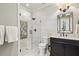 Modern bathroom showcasing a glass shower, decorative tile, and a dark vanity with white countertops at 4431 Skyland Ne Dr, Atlanta, GA 30342