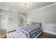 Bedroom with hardwood floors, chandelier, and lots of natural light at 4431 Skyland Ne Dr, Atlanta, GA 30342