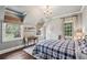 Charming bedroom with a chandelier, vaulted ceilings, and hardwood floors at 4431 Skyland Ne Dr, Atlanta, GA 30342