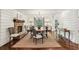 Elegant dining room with brick fireplace, hardwood floors, and large windows for natural light at 4431 Skyland Ne Dr, Atlanta, GA 30342