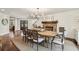 Formal dining area features wood table, chandelier, and shiplap accent wall with fireplace, creating an inviting space at 4431 Skyland Ne Dr, Atlanta, GA 30342