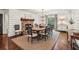 Dining room with a fireplace, wooden table and hardwood floors at 4431 Skyland Ne Dr, Atlanta, GA 30342