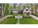 Stunning white brick home featuring a beautifully landscaped front yard and two-car garage at 4431 Skyland Ne Dr, Atlanta, GA 30342
