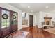Welcoming foyer with wood floors, white wainscoting, and a view of the staircase at 4431 Skyland Ne Dr, Atlanta, GA 30342