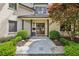 Inviting front entrance with dark wood double doors, stone pathway, and manicured landscaping at 4431 Skyland Ne Dr, Atlanta, GA 30342