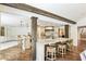 Spacious kitchen with a large island, marble countertops, stainless steel appliances, and wood beam accents at 4431 Skyland Ne Dr, Atlanta, GA 30342