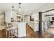 Bright and airy kitchen featuring a large island, custom cabinetry, and views into the living areas at 4431 Skyland Ne Dr, Atlanta, GA 30342