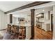 Open-concept kitchen with a large island, marble countertops, stainless steel appliances, and wooden accents at 4431 Skyland Ne Dr, Atlanta, GA 30342