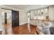 Entertainers wet bar featuring a sink, wine cooler, and storage cabinets, complemented by comfortable seating at 4431 Skyland Ne Dr, Atlanta, GA 30342