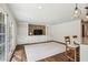 Spacious living room features a brick accent wall with built-in shelving and french doors at 4431 Skyland Ne Dr, Atlanta, GA 30342