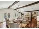 Well-lit living room featuring french doors, hardwood floors, and an open layout connecting to the kitchen at 4431 Skyland Ne Dr, Atlanta, GA 30342