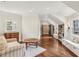 Inviting living room with hardwood floors, a cozy couch, and built-in bookshelves with seating at 4431 Skyland Ne Dr, Atlanta, GA 30342