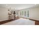 Open concept living space with bar seating leading to french doors to a pool at 4431 Skyland Ne Dr, Atlanta, GA 30342