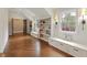 Bright room featuring hardwood floors, built-in bookshelves with seating, and natural light from windows at 4431 Skyland Ne Dr, Atlanta, GA 30342