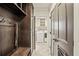Mudroom with built-in storage and bench, leading into the laundry room with white washer and dryer at 4431 Skyland Ne Dr, Atlanta, GA 30342