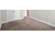 Bedroom features neutral carpet, baseboards, paint and double door closet at 4866 Pinnacle Dr, Stone Mountain, GA 30088
