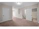 Spacious carpeted bedroom with ensuite bathroom access and a generously sized closet at 4866 Pinnacle Dr, Stone Mountain, GA 30088