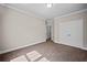 A clean, neutral bedroom has plush carpet, white trim and a closet at 4866 Pinnacle Dr, Stone Mountain, GA 30088