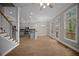 Open concept living room features hardwood floors, modern ceiling fan and plenty of natural light at 4866 Pinnacle Dr, Stone Mountain, GA 30088