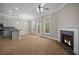 Open concept living room features modern ceiling fan, fireplace, and hardwood floors at 4866 Pinnacle Dr, Stone Mountain, GA 30088