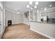 Open concept living room features a staircase, modern fireplace, and hardwood floors at 4866 Pinnacle Dr, Stone Mountain, GA 30088