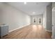 Neutral living room features hardwood floors and access to outdoor deck at 4866 Pinnacle Dr, Stone Mountain, GA 30088