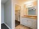 This bathroom has double sinks, a granite countertop, and a walk-in closet through the doorway at 8404 Park Ridge Ln, Riverdale, GA 30274