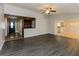Open-concept living room showcasing hardwood floors and seamless flow to other areas at 8404 Park Ridge Ln, Riverdale, GA 30274