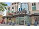 Building entrance of Spire with vibrant restaurants and retail shops, creating a lively street presence at 860 Peachtree Ne St # 1103, Atlanta, GA 30308