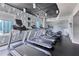 Well-equipped community gym with treadmills and elliptical machines featuring city views at 860 Peachtree Ne St # 1103, Atlanta, GA 30308