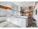 Kitchenette featuring white cabinetry, a countertop, and views of the game room and seating area at 860 Peachtree Ne St # 1103, Atlanta, GA 30308