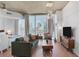 Cozy living room featuring comfortable seating, concrete ceilings and city views at 860 Peachtree Ne St # 1103, Atlanta, GA 30308