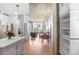 Open floor plan living and dining area with hardwood floors, concrete ceiling, and city views at 860 Peachtree Ne St # 1103, Atlanta, GA 30308