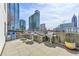 Rooftop grilling area with several stainless steel grills offering city views and a place to gather at 860 Peachtree Ne St # 1103, Atlanta, GA 30308