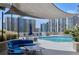 Community rooftop pool featuring ample seating areas and views of the surrounding city skyline at 860 Peachtree Ne St # 1103, Atlanta, GA 30308