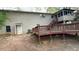 Back of house showing screened in porch and deck with yard at 99 Fox Ridge Ct, Dallas, GA 30157