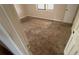 Bedroom with carpet, showing interior door and natural light from the window at 99 Fox Ridge Ct, Dallas, GA 30157