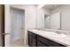 Bathroom featuring double sinks with granite countertops and modern fixtures, with a view into another rooms at 164 Weldon Rd, Mcdonough, GA 30253